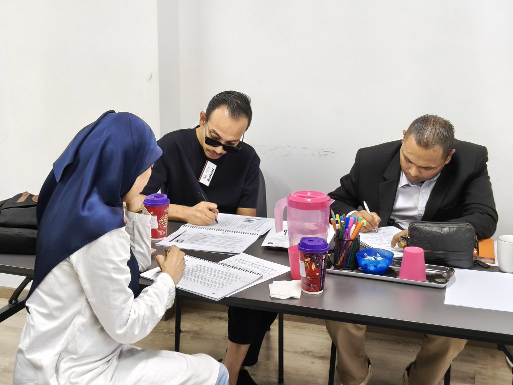 Participants in Effective Leadership & Communication Mastery training, they work on